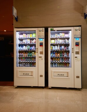 Two vending machines with a variety of beverages and snacks. - Holiday Inn Express Luoyang City Center by IHG (Luoyang)