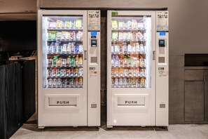 Two vending machines with a variety of beverages and snacks. - Holiday Inn Express Luoyang City Center by IHG (Luoyang)
