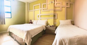 A hotel room with two beds, a nightstand, and a wall with geometric patterns. - Sunshine Inn Malacca (Malacca City)