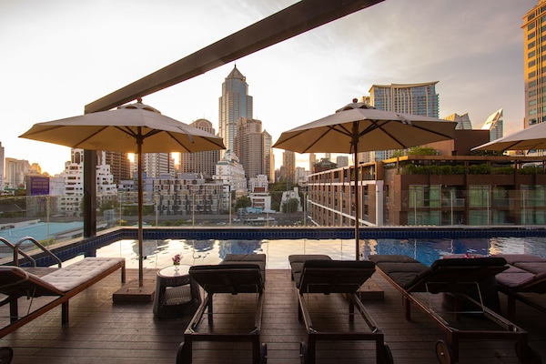 Outdoor pool, open 7:00 AM to 8:00 PM, pool umbrellas, pool loungers