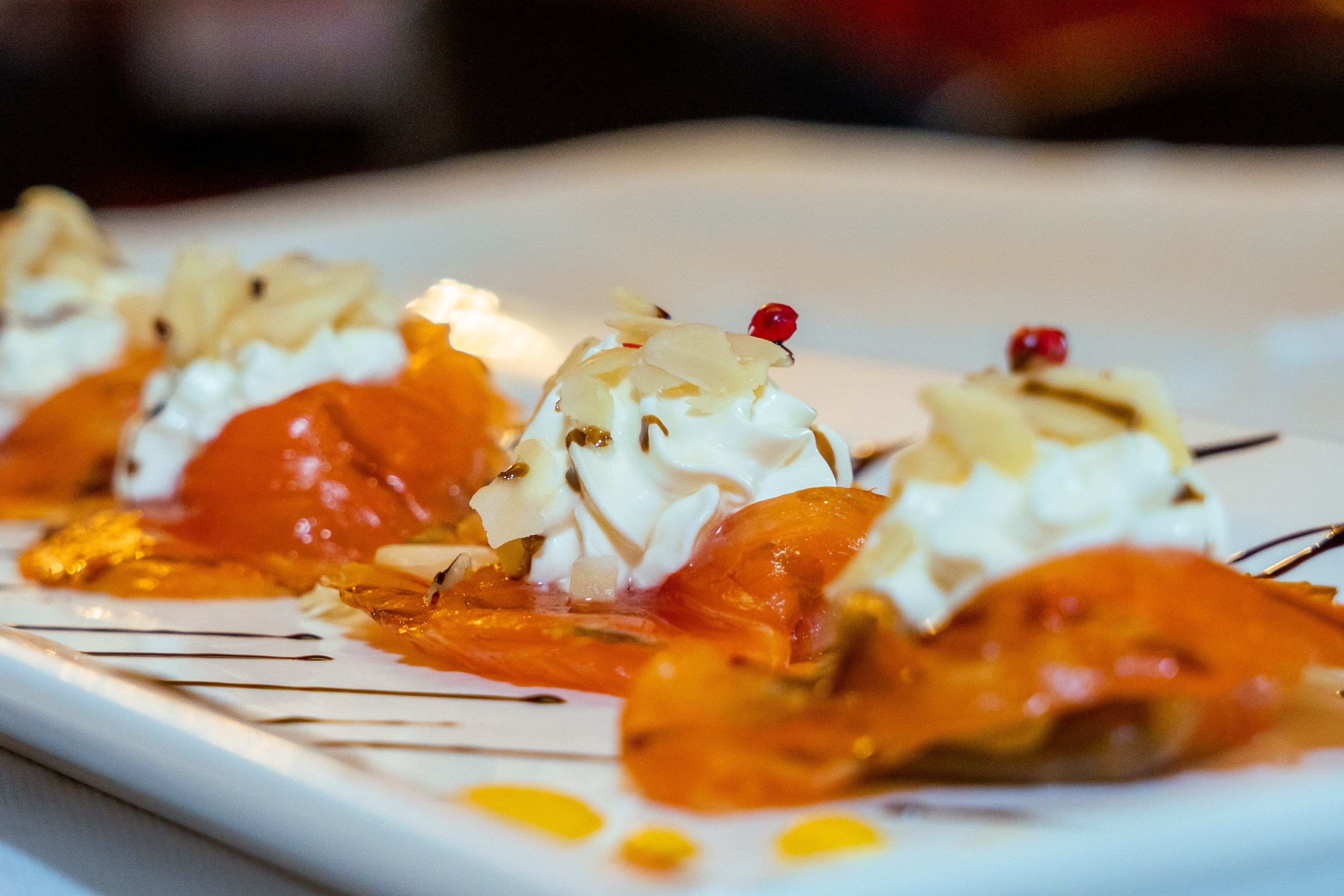 A dessert plate with various toppings and sauces.