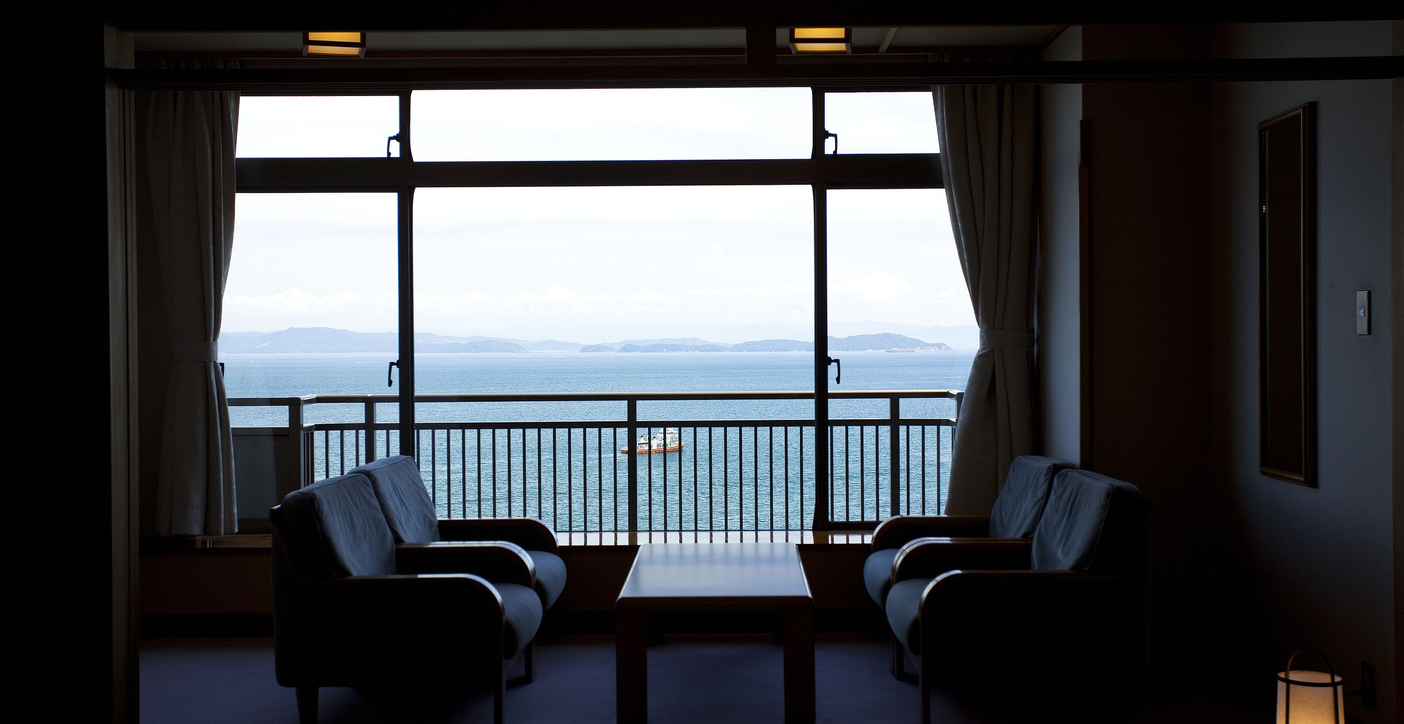 japanese style room with open-air onsen | living area | flat-screen tv