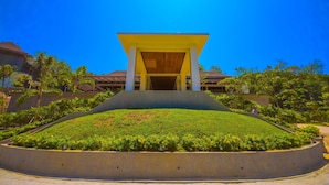 A modern building with a flat roof and a central entrance. - Crystal Wild Resort Panwa Phuket (Wichit)