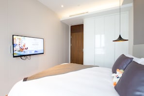Deluxe Suite, 2 Bedrooms | Down comforters, in-room safe, desk, laptop workspace
