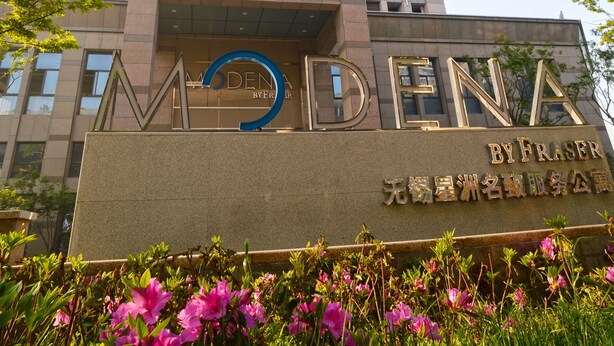 A modern building with a prominent sign reading "MODENA BY FRASER". - Modena by Fraser New District Wuxi (Wuxi)