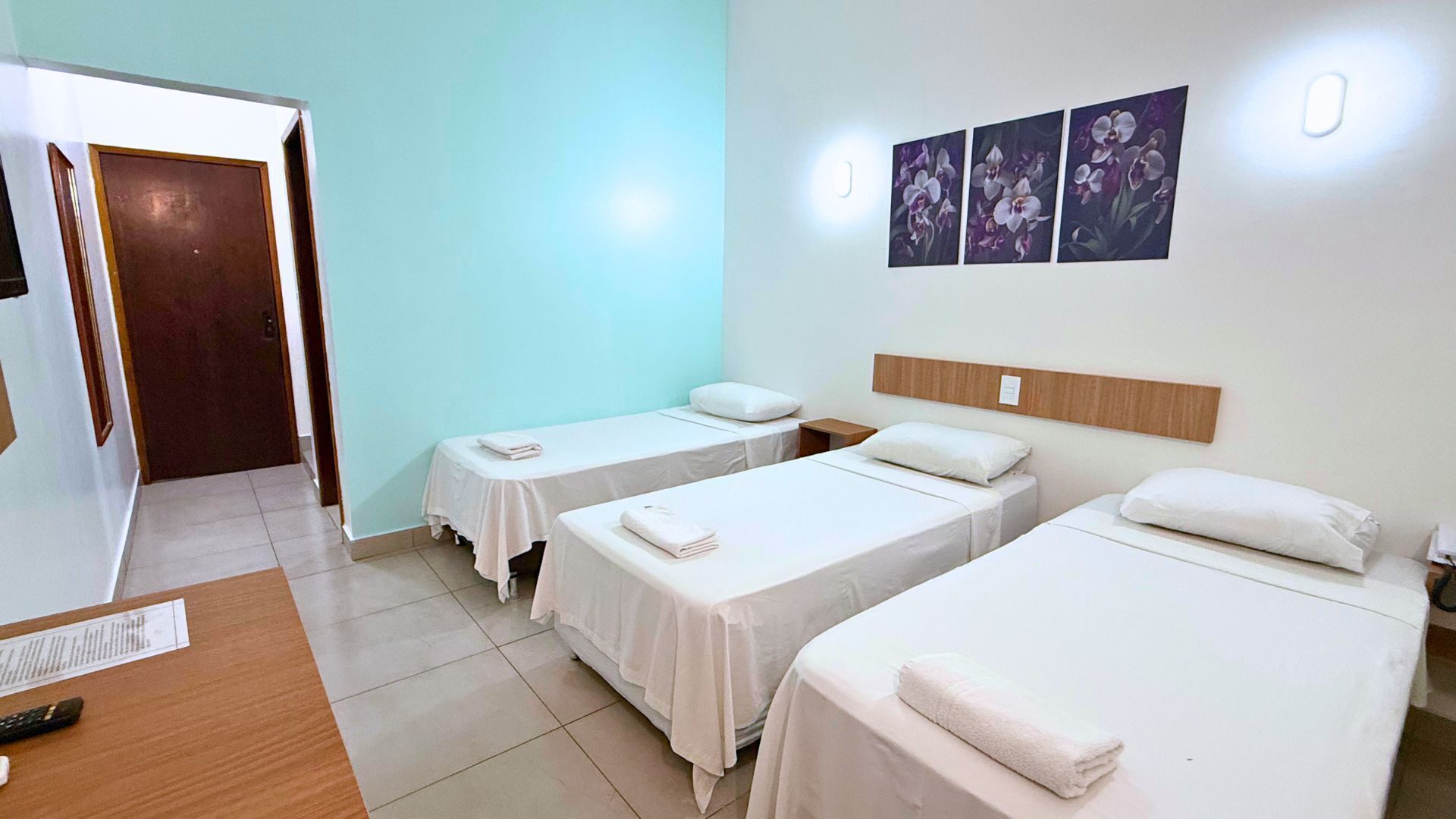 Triple Room | Minibar, blackout drapes, WiFi (free), bed sheets