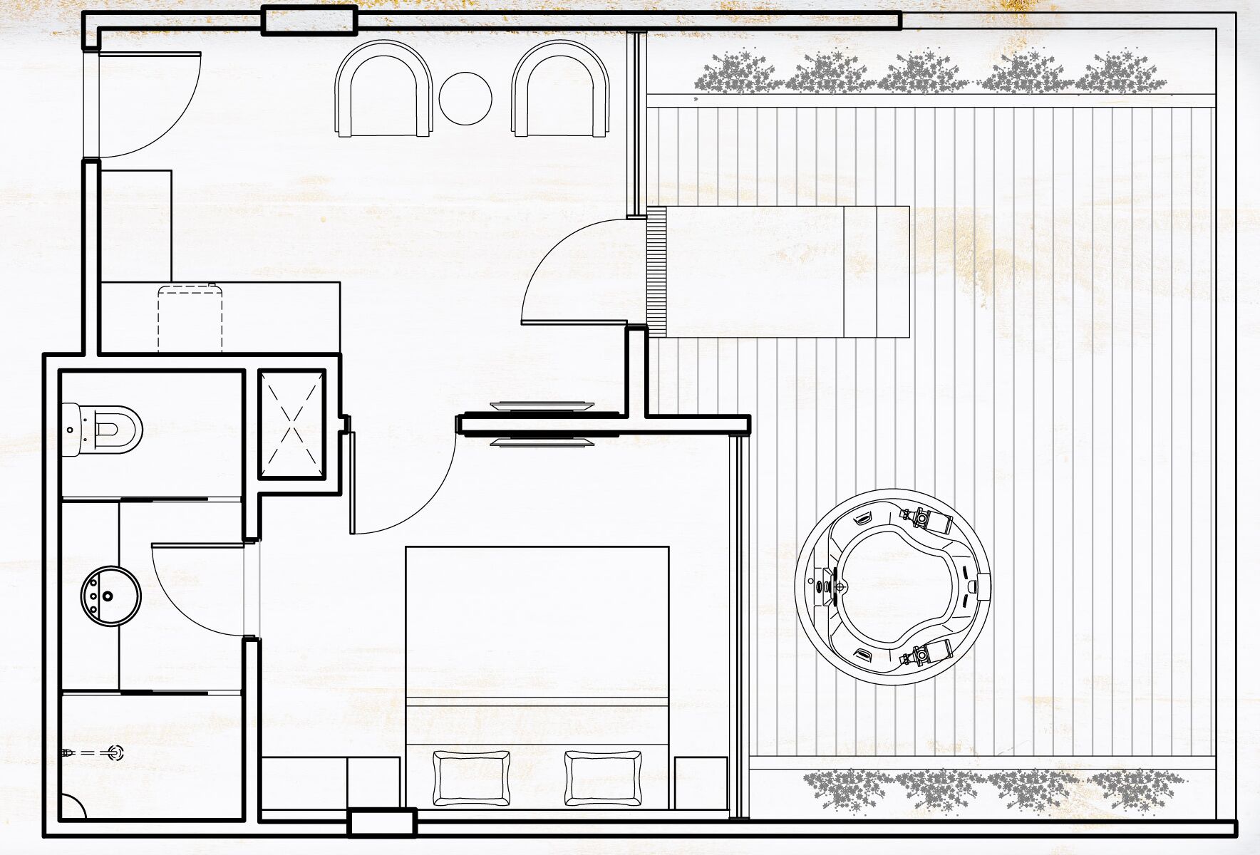 Un plano de planta que muestra una cocina, comedor, dos dormitorios, un baño y una zona exterior circular.