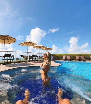 Outdoor pool, pool umbrellas, sun loungers