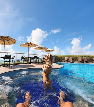 Outdoor pool, pool umbrellas, sun loungers