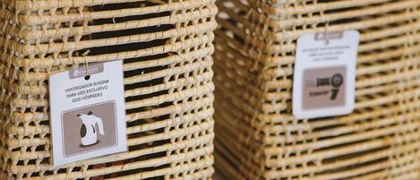 Two wicker baskets on a shelf.