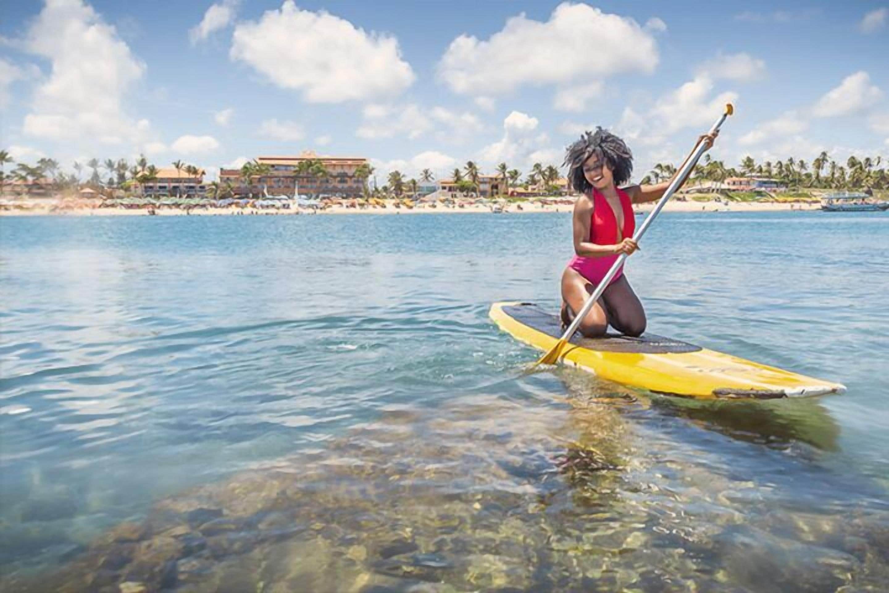 on the beach, sun-loungers, beach umbrellas, beach towels