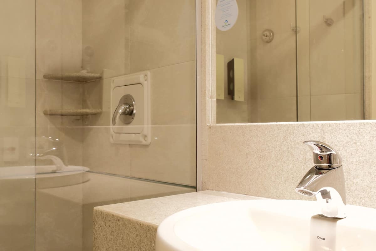 designer toiletries, hair dryer, towels, soap