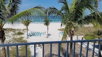 On the beach, surfing