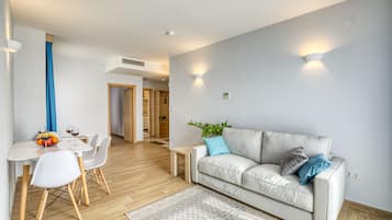 Family Apartment | In-room safe, desk, laptop workspace, blackout curtains