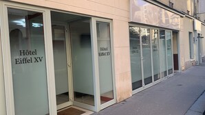 A hotel facade with large glass doors labeled "Hôtel Eiffel XV." - Hotel Eiffel XV (Paris)