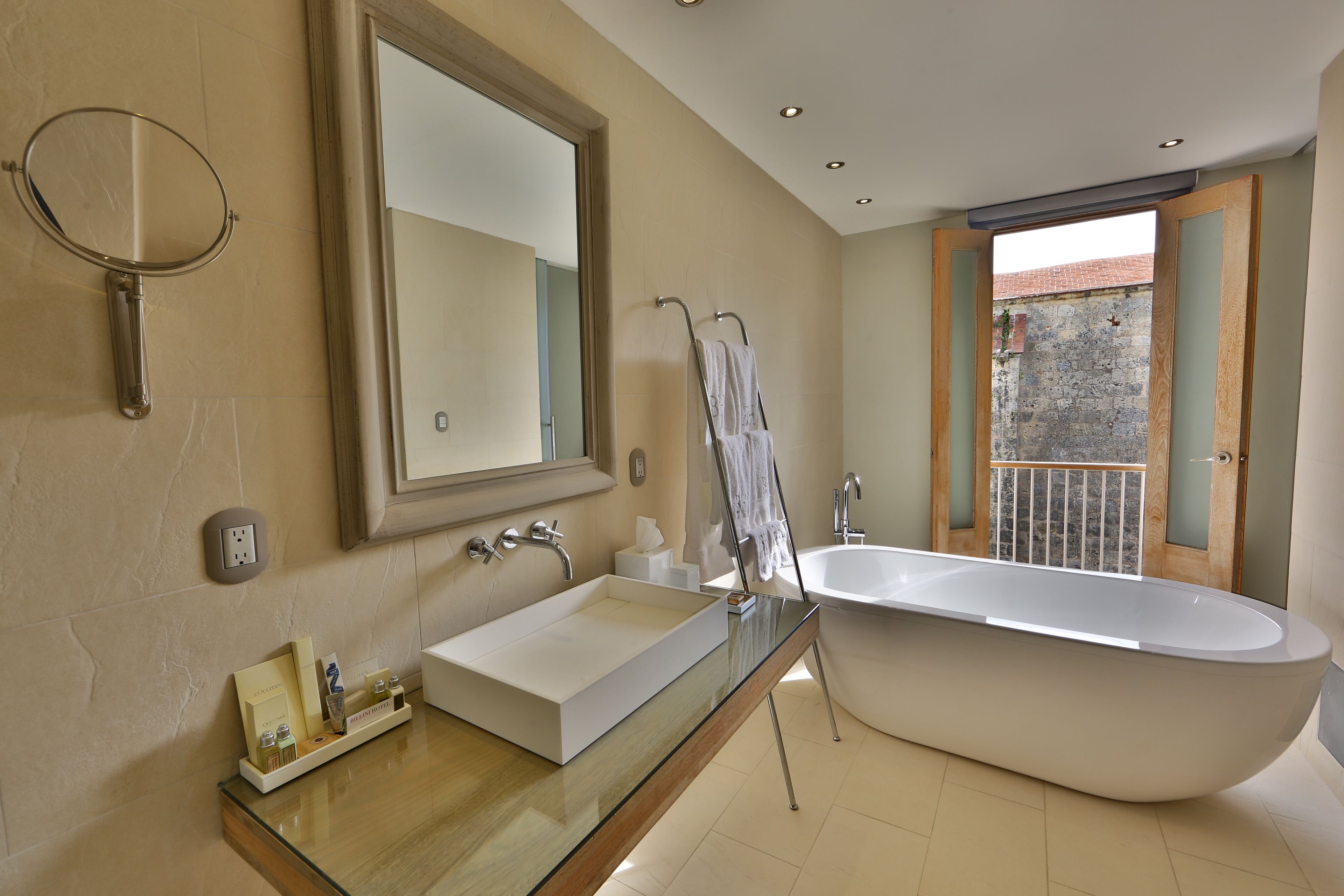 executive suite (cathedral view) | bathroom | designer toiletries, hair dryer, bathrobes, slippers