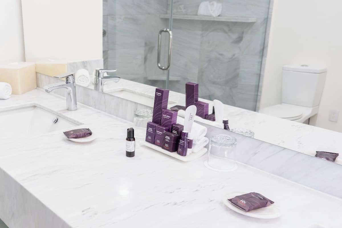 junior loft room | bathroom | shower, rainfall showerhead, designer toiletries, hair dryer