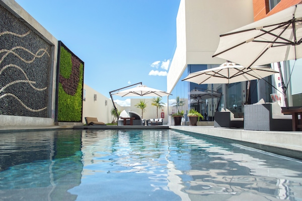 Outdoor pool, open 8:00 AM to 10:00 PM, pool umbrellas, pool loungers