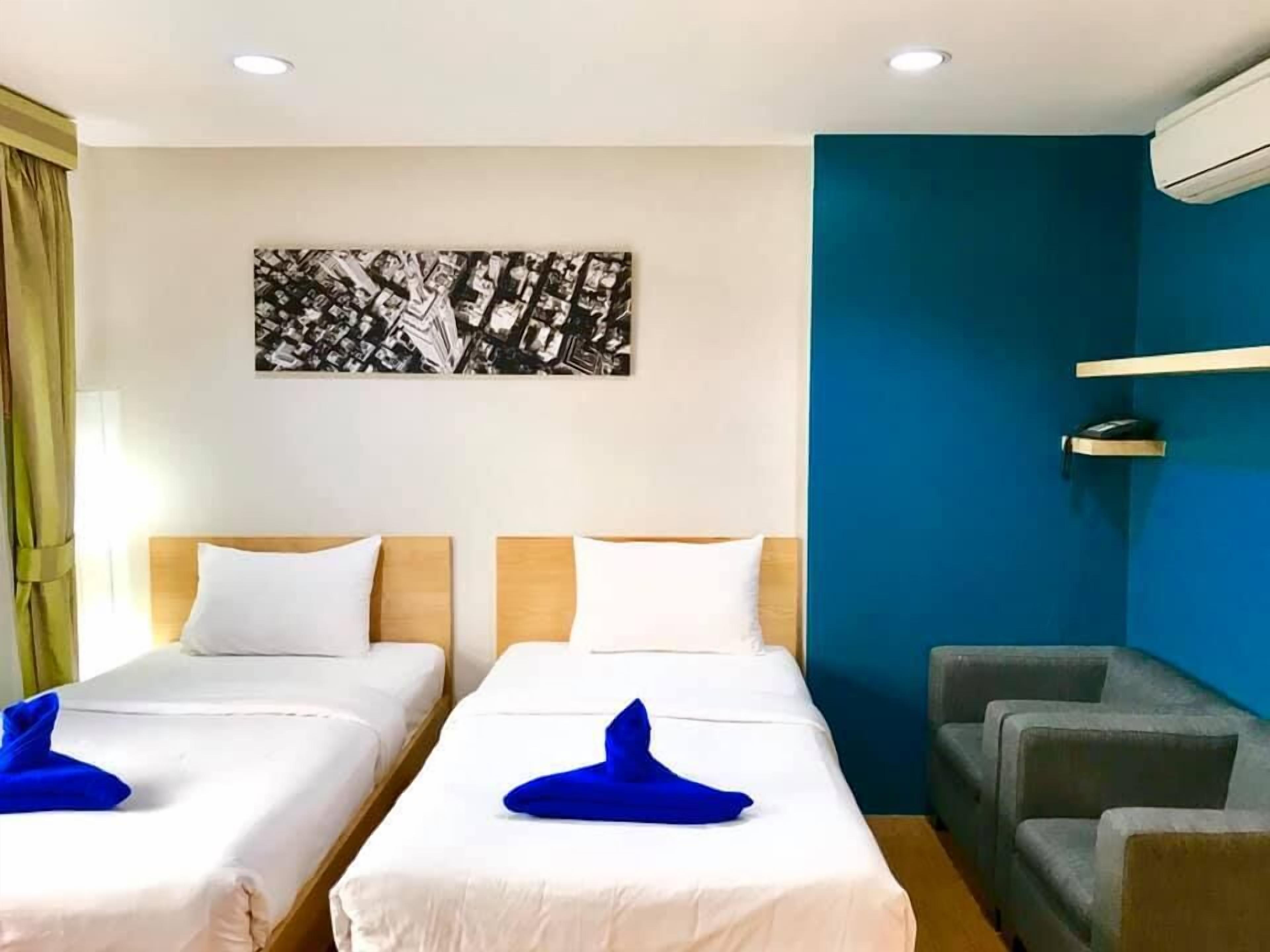 Habitación Deluxe con 2 camas individuales | Caja de seguridad en la habitación y wifi gratis 