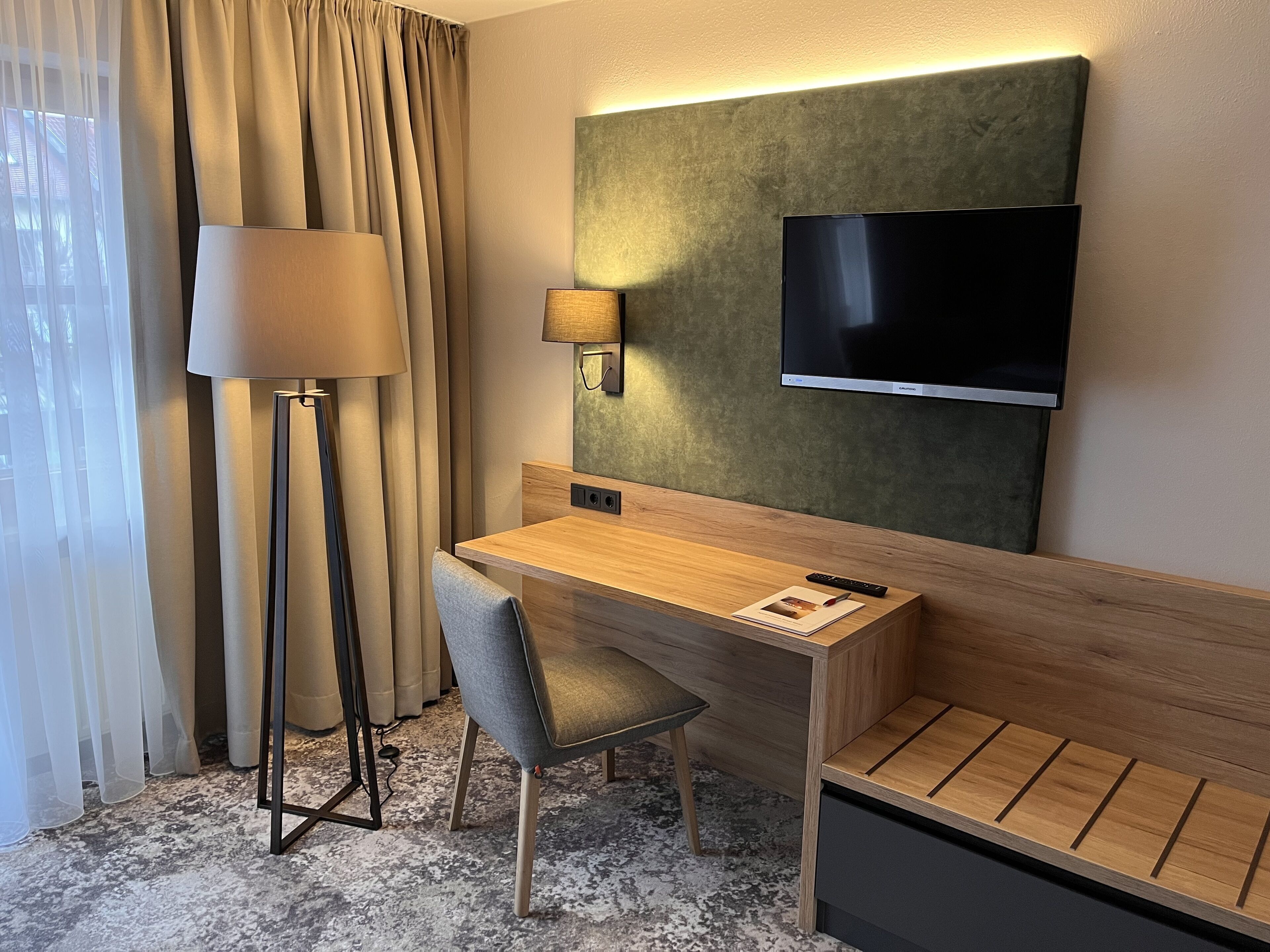 deluxe double room single use | living area | tv, pay films, offices