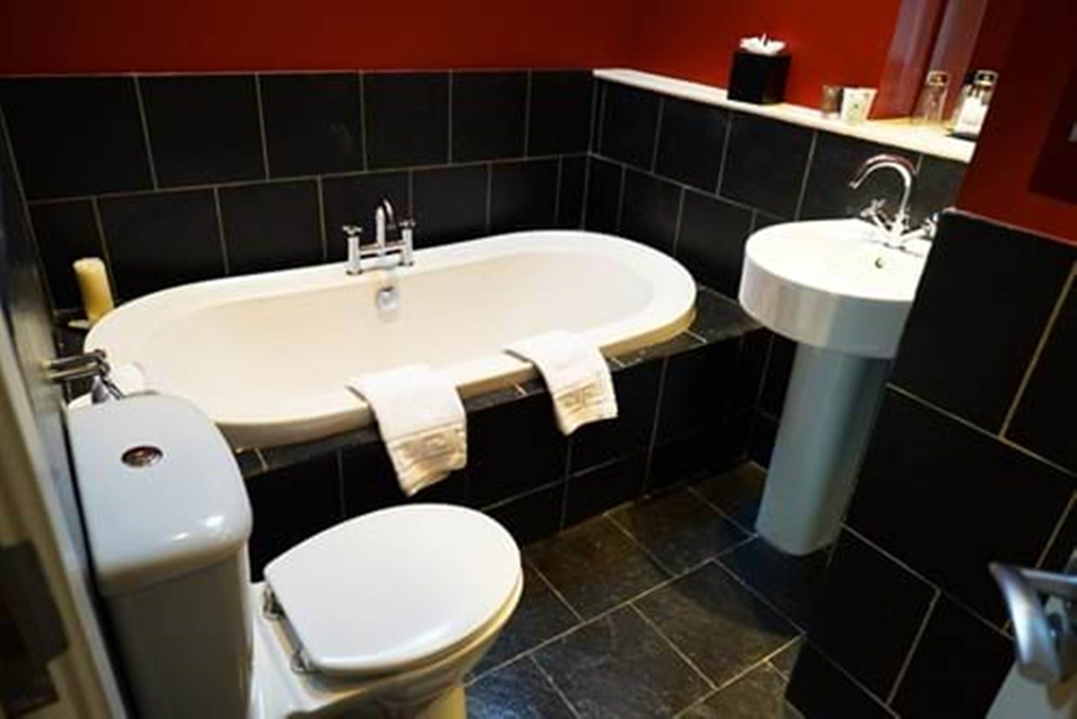 signature suite | bathroom | free toiletries, hair dryer, bathrobes, slippers