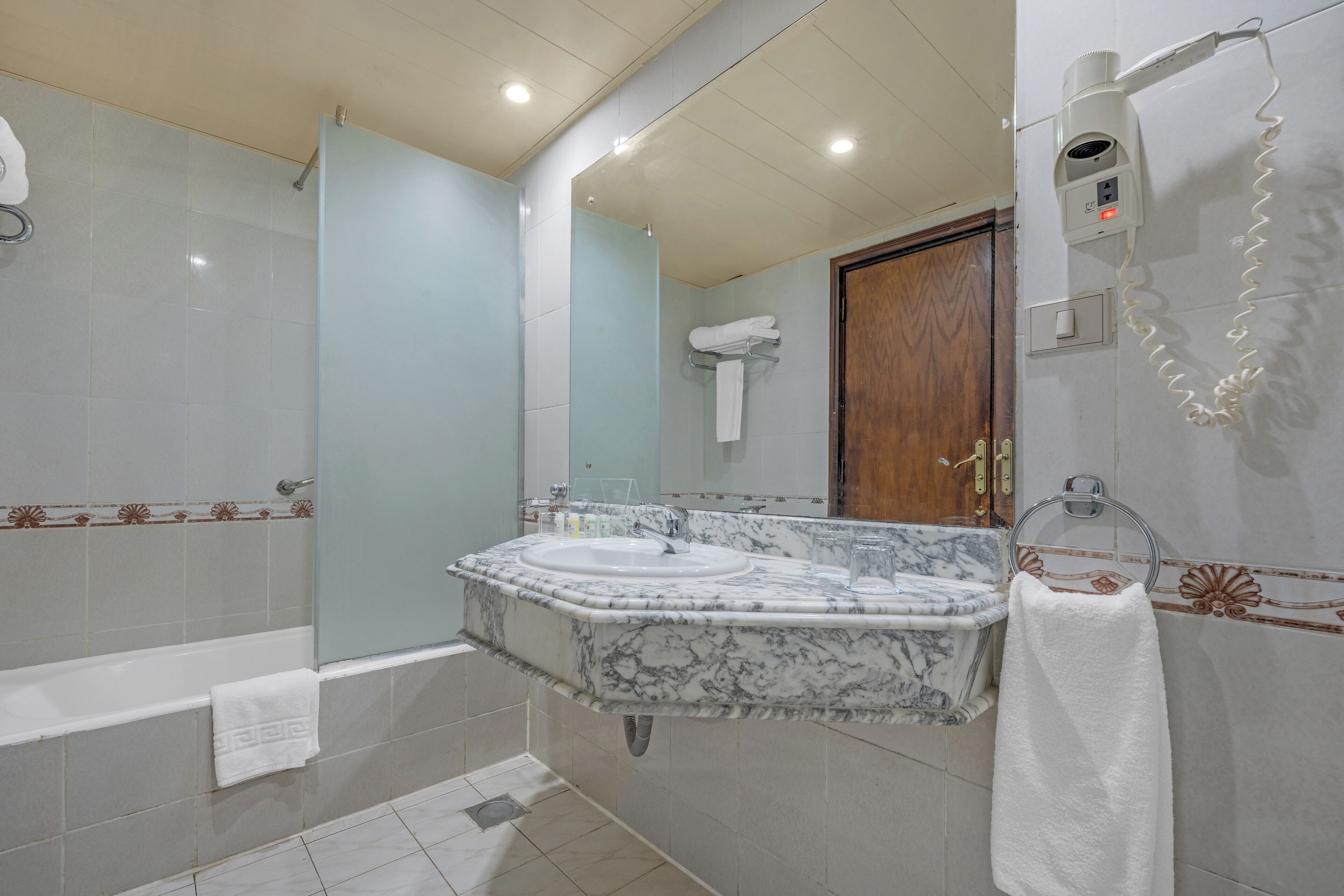 spring water bathtub, hair dryer, towels