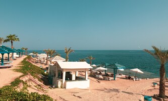 On the beach, sun loungers, beach umbrellas, beach towels
