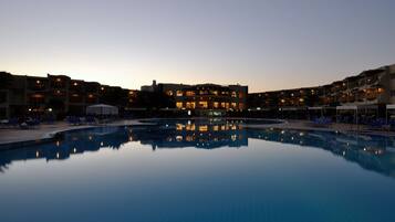 2 outdoor pools, open 8:00 AM to 5:30 PM, free cabanas, pool umbrellas