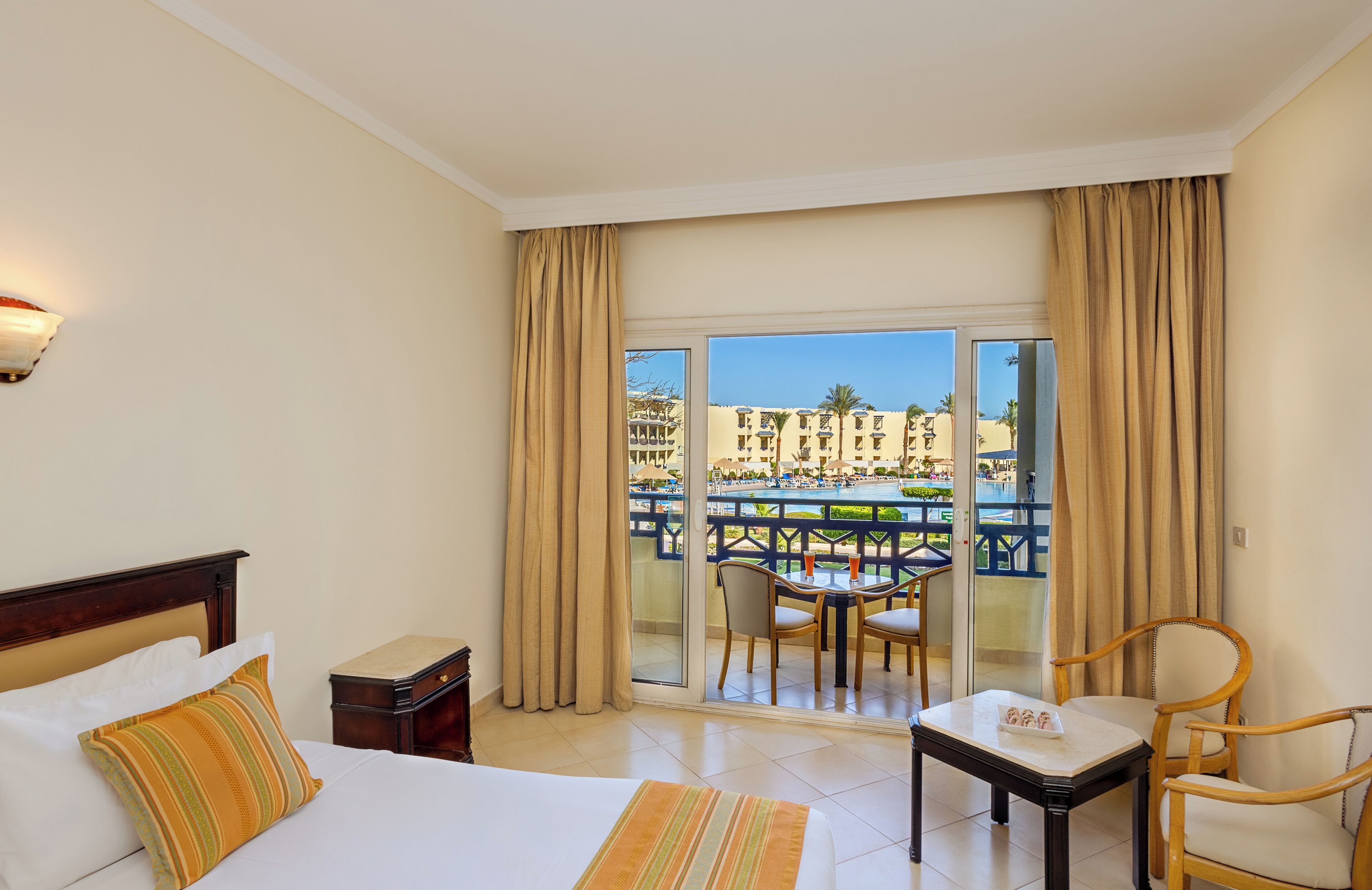 Standard Room, Multiple Beds, Pool View (Standard Pool View) | Pillowtop beds, minibar, in-room safe, blackout drapes