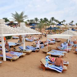 On the beach, sun-loungers, beach umbrellas, beach towels