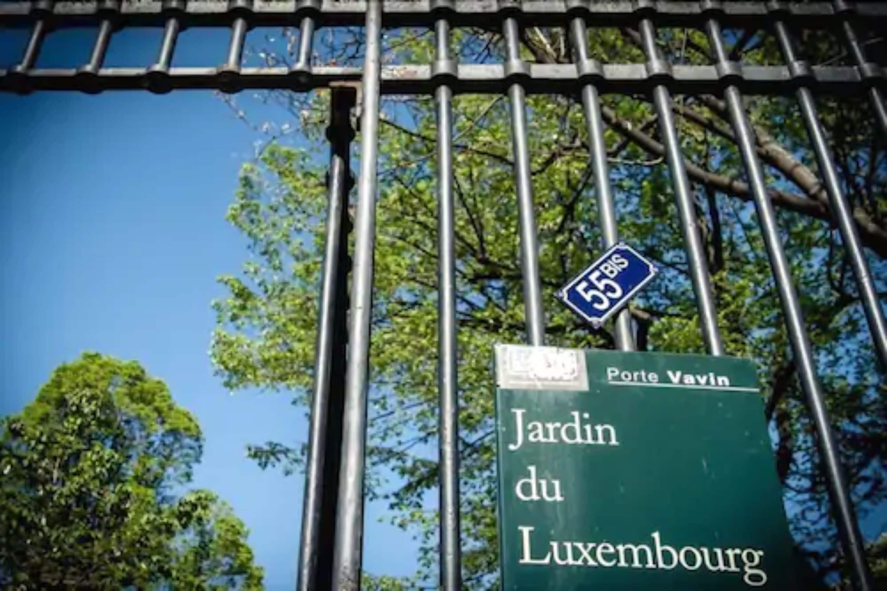 A street sign with "Jardin du Luxembourg" and "Porte Vavin" indicating a location.
