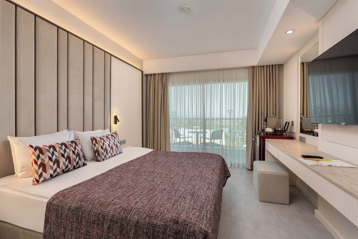 Family Room, Partial Sea View | Premium bedding, free minibar, in-room safe, desk