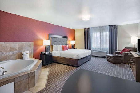 Premium bedding, in-room safe, desk, laptop workspace. Hawthorn Extended Stay by Wyndham Dickinson