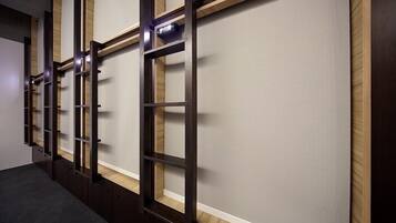 A hallway with dark wooden paneling and a light-colored wall.