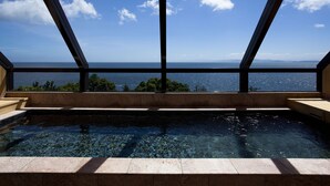 A modern indoor pool with a clear view of the ocean through large windows. - Shimahana (Sumoto)