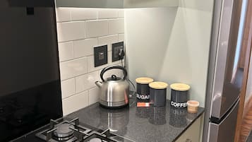 Mini-fridge, microwave, coffee/tea maker, electric kettle