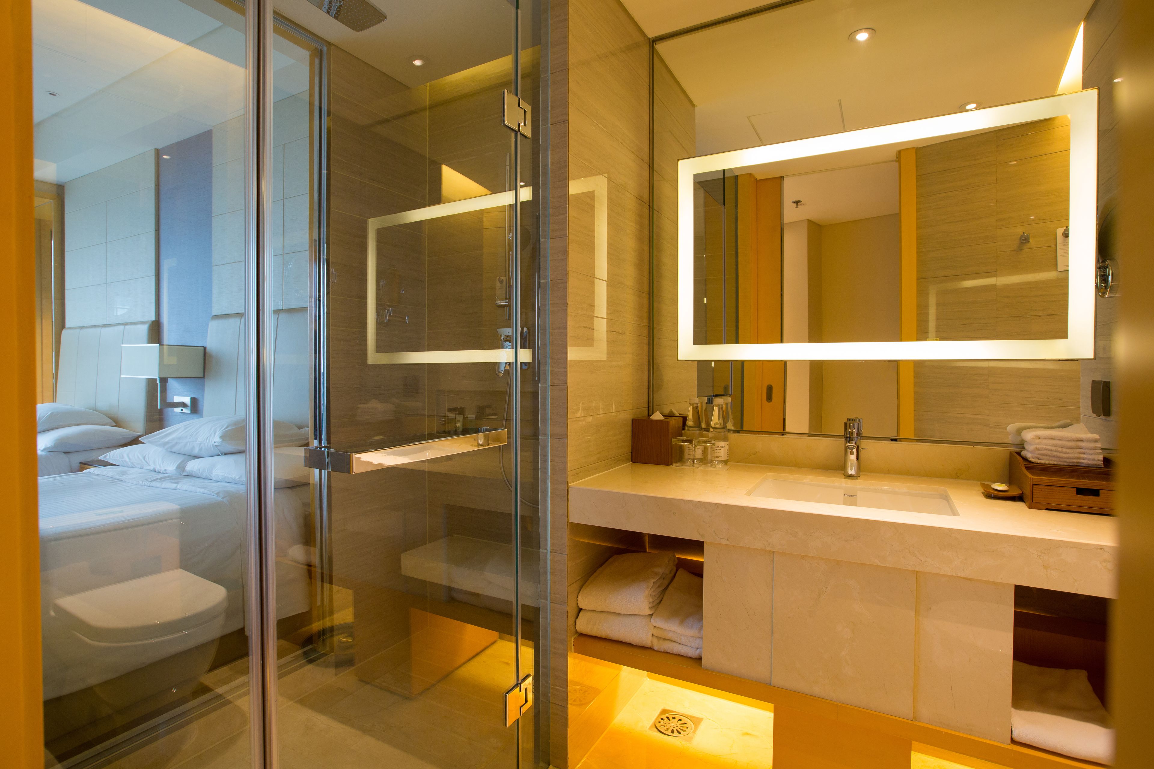 premier room, 1 king bed | bathroom | shower, free toiletries, hair dryer, bathrobes