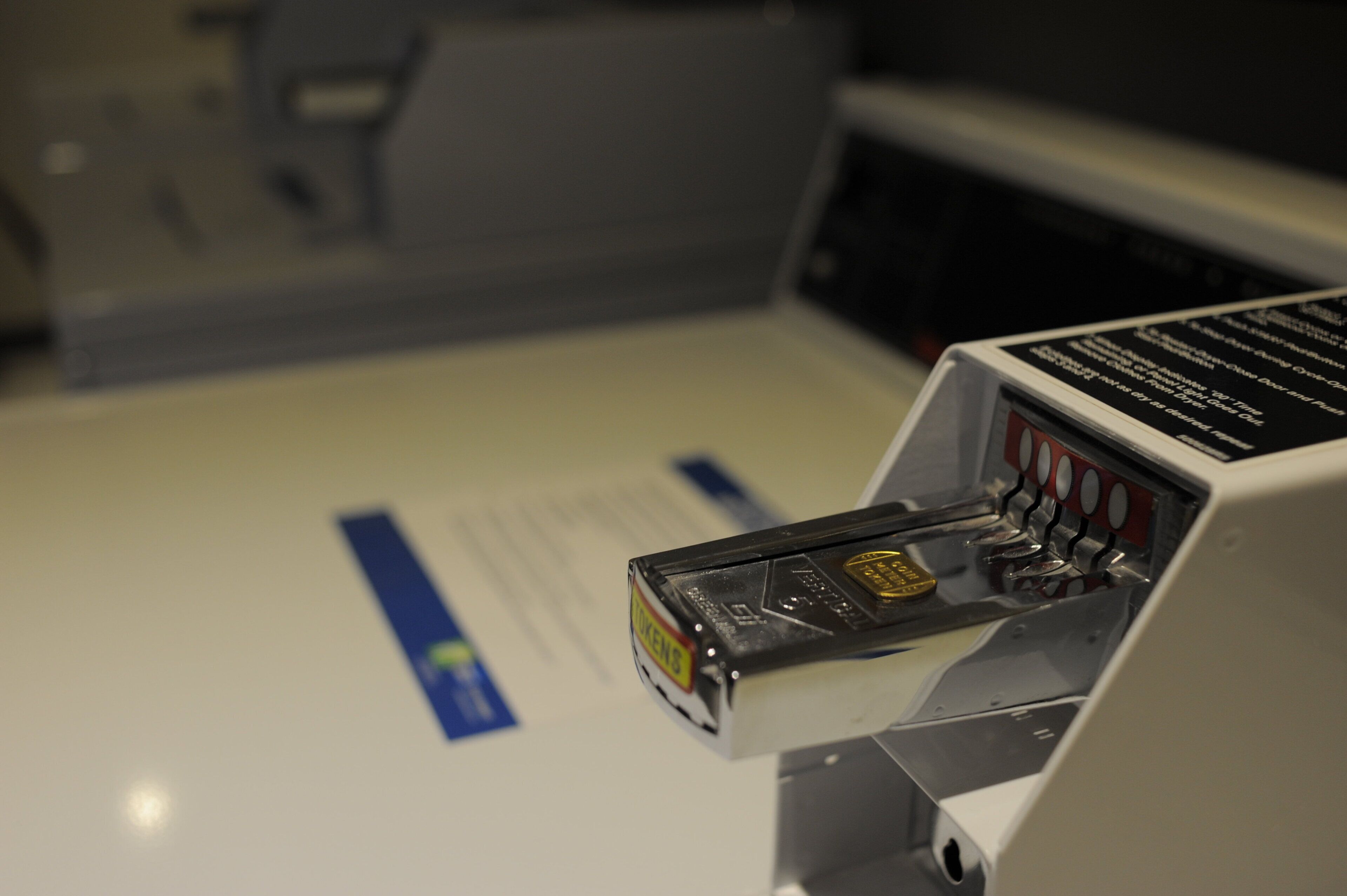 A close-up of a machine with a keypad and a card slot, likely a payment or ticket machine.