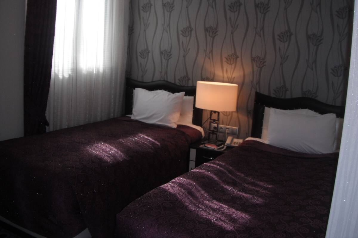 Triple Room | Minibar, in-room safe, WiFi (free), bed sheets