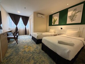 A hotel room with two beds, a desk, a chair, and a large window with curtains. - Sani Hotel Kuala Lumpur (Kuala Lumpur)
