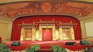 A stage with red curtains, a red carpet, and traditional Chinese decorations. - Harmoni One Convention Hotel & Service Apartments (Batam)