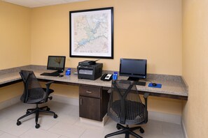 A workspace with two monitors, a printer, and two office chairs. - Holiday Inn Express & Suites Page - Lake Powell Area by IHG (Page)