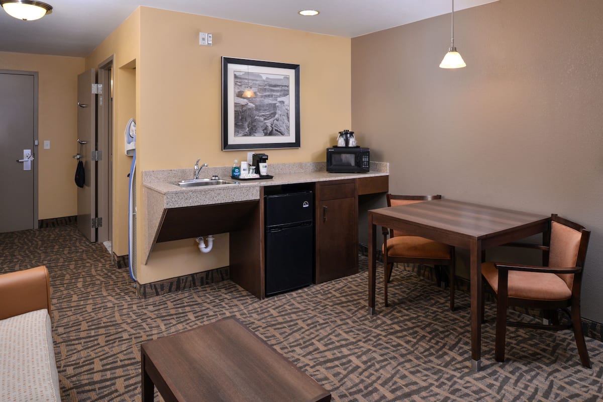 Suite, 1 King Bed, Roll-in Shower (Roll-In Shower) | Desk, blackout drapes, iron/ironing board, cribs (surcharge)