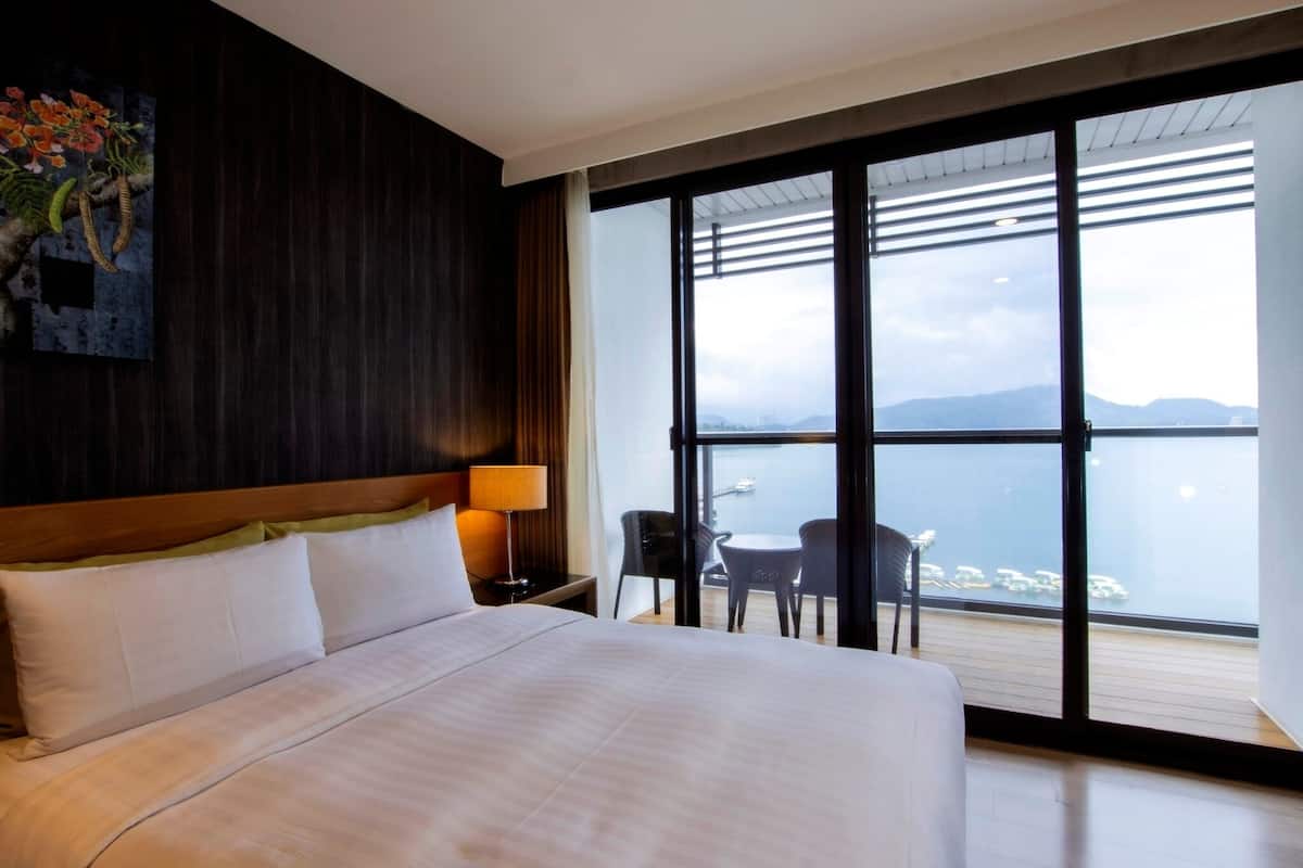 deluxe quadruple room, lake view | in-room safe, desk, blackout curtains, free wifi