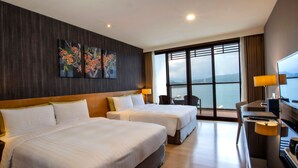 A hotel room with two beds, a desk, a TV, and a large window with a view. - Lealea Garden Hotels - Sun Lake (Yuchi)