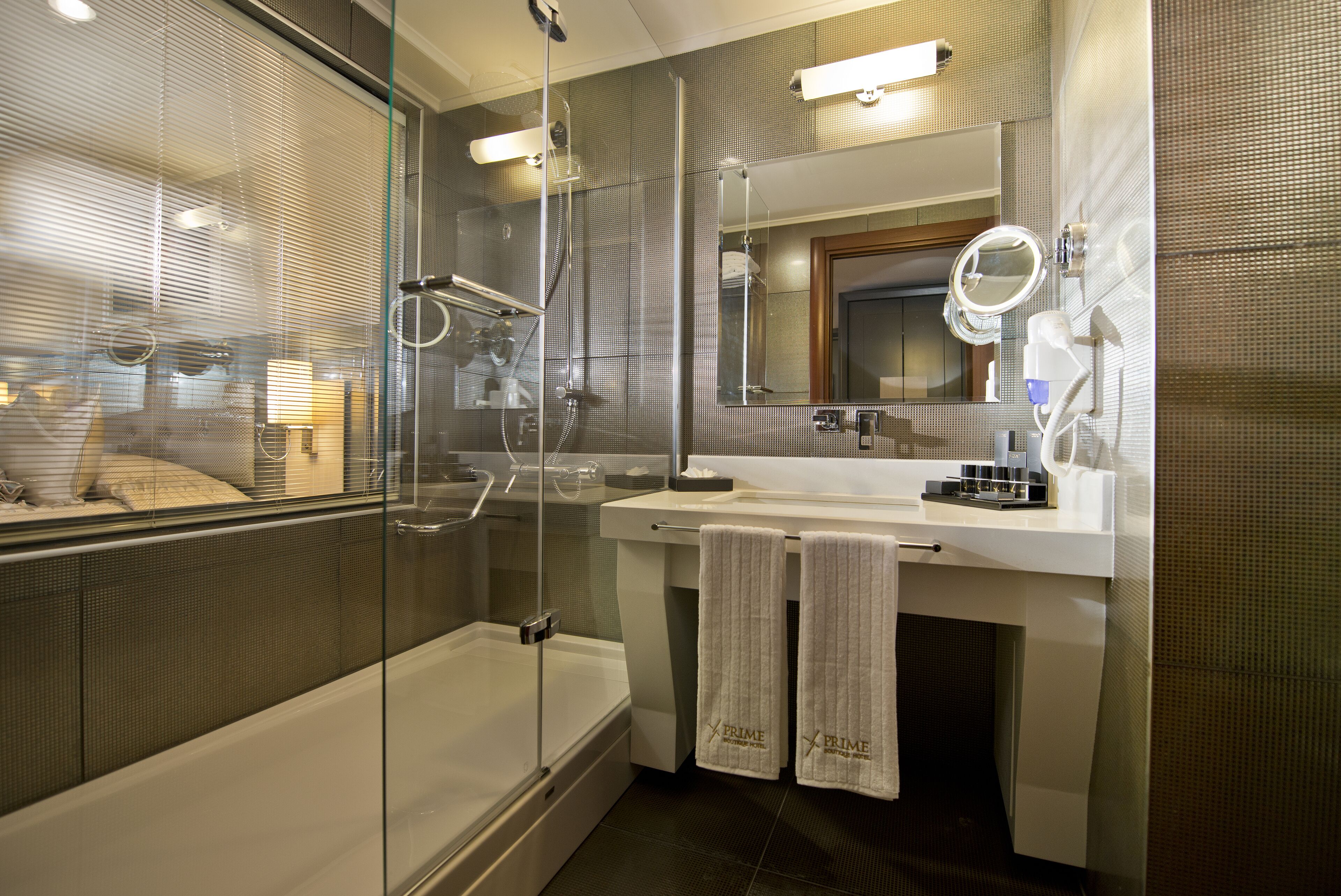 family room with land view | bathroom | deep-soaking bathtub, rainfall showerhead, free toiletries, hair dryer