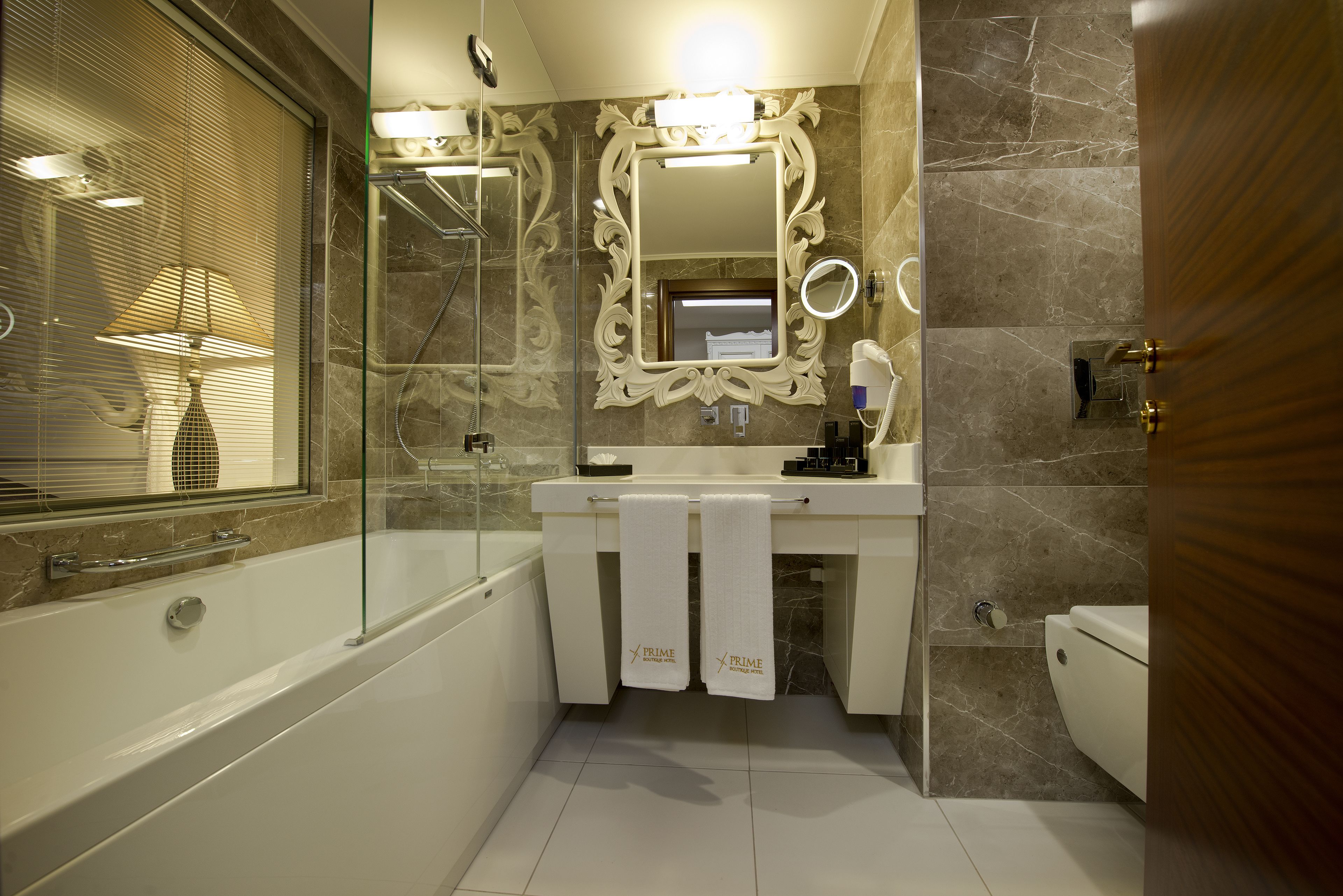 deep-soaking bathtub, rainfall showerhead, free toiletries, hair dryer