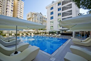 Seasonal outdoor pool, pool umbrellas, pool loungers