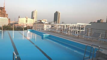 Outdoor pool, open 9:00 AM to 9:00 PM, pool loungers