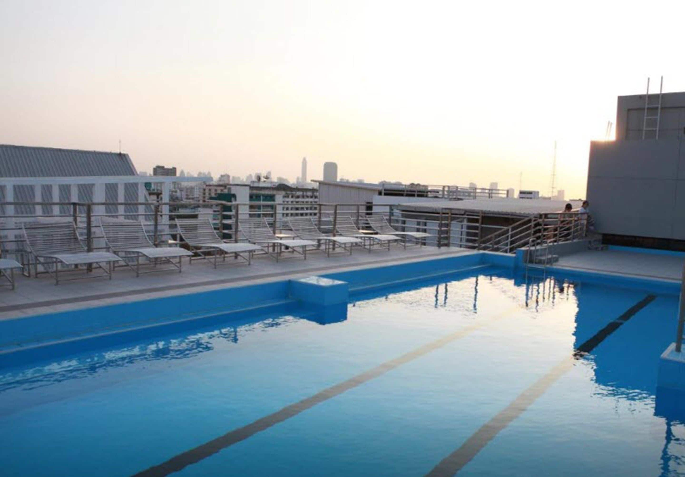 Outdoor pool, open 9:00 AM to 9:00 PM, pool loungers